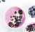 top view shot of a bowl of Annie's Immunity Acai frozen smoothie topped with blueberries, blackberries and oats beside a bowl of blueberries and another bowl of frozen smoothie.