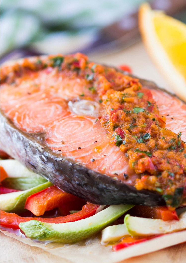 julienned red and green bell peppers topped with a slice of red snapper with salsa toppings.