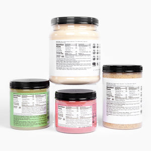 4 jars with nutrition facts against a white background.