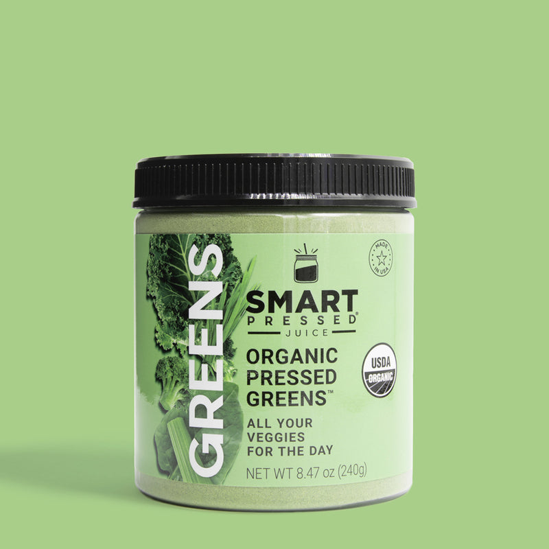 one jar of 240 grams Organic Pressed Greens against a light green background.